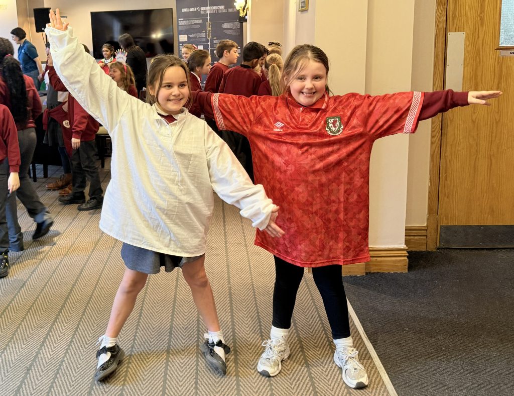 Children dressing up in replica historic and modern football kit